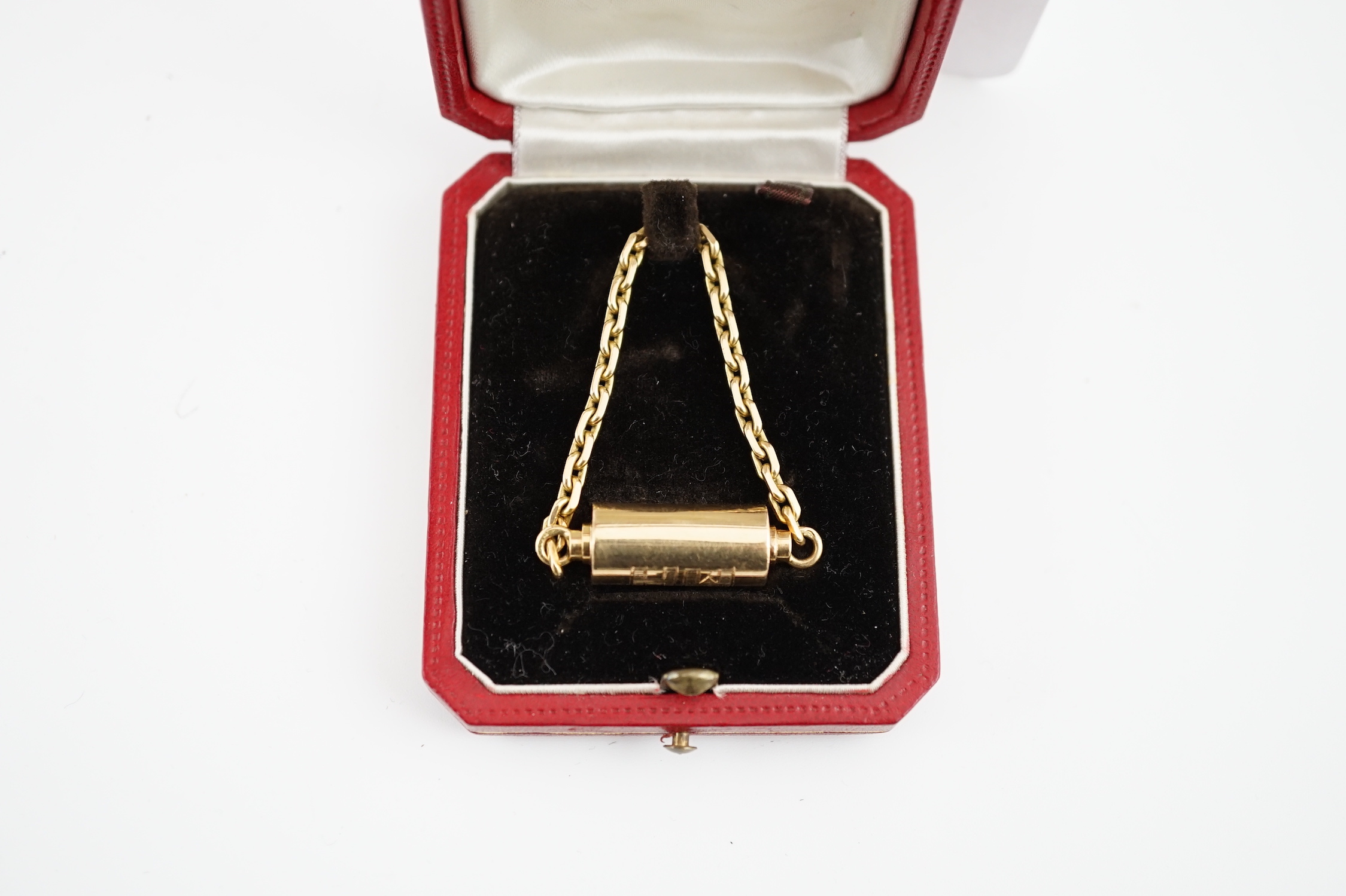 A mid to late 20th century Cartier 18ct gold barrel shaped key ring, with suspension chain